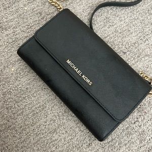 Small black Michael Kors Crossbody with pockets for phone and cards
